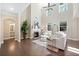 Bright living room with vaulted ceilings, fireplace, hardwood floors, and many windows at 2890 Canter Meadow Dr, Cumming, GA 30040