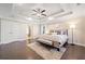 Spacious main bedroom boasts a tray ceiling, hardwood floors and modern furnishings at 2890 Canter Meadow Dr, Cumming, GA 30040