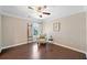 Cozy sitting room with hardwood floors, natural light, and comfortable seating at 2890 Canter Meadow Dr, Cumming, GA 30040