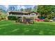 Lush green backyard with a patio area and a variety of colorful flowers and bushes at 2920 Dara Dr, Marietta, GA 30066