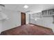 Unfinished basement with painted walls and ceiling, and a sliding door access to outside at 2920 Dara Dr, Marietta, GA 30066