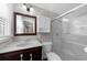 Clean bathroom with tiled shower, vanity with granite countertop, and framed mirror at 2920 Dara Dr, Marietta, GA 30066