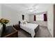 Inviting bedroom with cozy carpet, a black-framed bed, and a ceiling fan at 2920 Dara Dr, Marietta, GA 30066