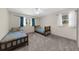 Cozy bedroom featuring two twin beds, soft gray carpet, and natural light from two windows at 2920 Dara Dr, Marietta, GA 30066