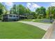 Charming home with a long driveway, lush front lawn, and mature trees at 2920 Dara Dr, Marietta, GA 30066