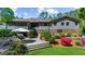 Charming backyard with a screened in porch, patio, lush landscaping, and a well maintained lawn at 2920 Dara Dr, Marietta, GA 30066