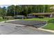 Well-maintained front yard with unique rock landscaping, green grass, and mature trees at 2920 Dara Dr, Marietta, GA 30066