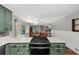 A view of the green kitchen with countertop, oven and view into the dining and living area at 2920 Dara Dr, Marietta, GA 30066