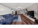 Spacious living room features wood floors, brick fireplace and a large, inviting blue sectional sofa at 2920 Dara Dr, Marietta, GA 30066