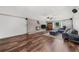 A view of the living room with a fireplace, blue sofa, and hardwood floors at 2920 Dara Dr, Marietta, GA 30066