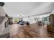 Spacious living room featuring hardwood floors, a brick fireplace, and open layout at 2920 Dara Dr, Marietta, GA 30066