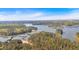An aerial view of a lake and multiple boat storage docks surrounded by forest at 5400 Kings Camp Cabin 16 Se Rd, Acworth, GA 30102