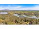 An aerial view of a large lake with boat storage docks surrounded by many trees at 5400 Kings Camp Cabin 16 Se Rd, Acworth, GA 30102
