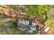 Aerial view of the property with trees surrounding the buildings at 5400 Kings Camp Cabin 16 Se Rd, Acworth, GA 30102
