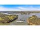 Aerial view of large lake with boat storage docks surrounded by trees at 5400 Kings Camp Cabin 16 Se Rd, Acworth, GA 30102