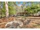 Scenic backyard with a fire pit and outdoor seating area at 5400 Kings Camp Cabin 16 Se Rd, Acworth, GA 30102