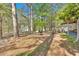 Scenic backyard featuring a fire pit and wooded views at 5400 Kings Camp Cabin 16 Se Rd, Acworth, GA 30102