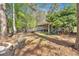 Scenic backyard with a fire pit and outdoor seating area at 5400 Kings Camp Cabin 16 Se Rd, Acworth, GA 30102
