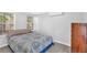 Comfortable bedroom with a large bed, hardwood floors, and natural light at 5400 Kings Camp Cabin 16 Se Rd, Acworth, GA 30102