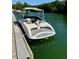 View of a boat docked along the edge of the lake with surrounding trees at 5400 Kings Camp Cabin 16 Se Rd, Acworth, GA 30102