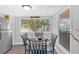 Cozy dining area features a round table with chairs and a sunlit window at 5400 Kings Camp Cabin 16 Se Rd, Acworth, GA 30102