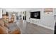 Spacious living room with modern flooring, large windows, and comfortable seating at 5400 Kings Camp Cabin 16 Se Rd, Acworth, GA 30102