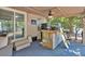 The outdoor bar area includes a custom-built bar with a sink, ice maker and an adjacent seating area at 5400 Kings Camp Cabin 16 Se Rd, Acworth, GA 30102