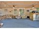Spacious covered patio with ceiling fans, comfortable seating, and a bar area for entertaining at 5400 Kings Camp Cabin 16 Se Rd, Acworth, GA 30102