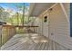 Exterior door with access to covered wooden porch and backyard, offering a relaxing space at 5400 Kings Camp Cabin 16 Se Rd, Acworth, GA 30102