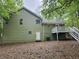 Back of the house with a white deck and staircase in the backyard at 14 Highland Dr, Carrollton, GA 30116