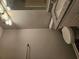 Bathroom featuring a granite countertop vanity, a toilet and updated lighting at 14 Highland Dr, Carrollton, GA 30116