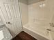Bathroom featuring a tiled shower, granite countertop and wood flooring at 14 Highland Dr, Carrollton, GA 30116
