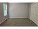 Bedroom with neutral wall colors, plush carpeting, and a large closet at 14 Highland Dr, Carrollton, GA 30116