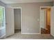 Cozy bedroom offering ample closet space, neutral walls, and plush carpeting at 14 Highland Dr, Carrollton, GA 30116