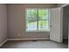 Bedroom featuring a view from the large window and plush carpeting at 14 Highland Dr, Carrollton, GA 30116