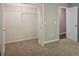 Walk-in closet featuring ample storage space with wire shelving and an open doorway at 14 Highland Dr, Carrollton, GA 30116