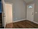 Well-lit entryway with laminate flooring and entry door at 14 Highland Dr, Carrollton, GA 30116