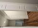 Hallway features laminate flooring and fresh, neutral paint at 14 Highland Dr, Carrollton, GA 30116