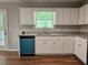 Kitchen with white cabinets, granite countertops, stainless steel appliances, and hardwood floors at 14 Highland Dr, Carrollton, GA 30116