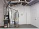 Mechanical room with water heater, furnace, and ductwork at 14 Highland Dr, Carrollton, GA 30116