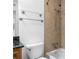 Bathroom featuring tub with tile surround and modern fixtures at 1468 Briarwood Ne Rd # 602, Atlanta, GA 30319