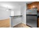 Open kitchen featuring granite counters, stainless refrigerator and breakfast bar at 1468 Briarwood Ne Rd # 602, Atlanta, GA 30319