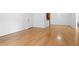 Light-filled living room with hardwood floors and views into the kitchen and entryway at 1468 Briarwood Ne Rd # 602, Atlanta, GA 30319