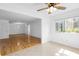 Inviting living room showcasing gleaming hardwood floors and a ceiling fan, adjacent to tiled bonus area at 1468 Briarwood Ne Rd # 602, Atlanta, GA 30319