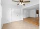 Open-concept living area with tile flooring, ceiling fan and views into the dining area at 1468 Briarwood Ne Rd # 602, Atlanta, GA 30319
