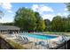 Community pool with plenty of lounge chairs and a beautiful view of the surrounding area at 1468 Briarwood Ne Rd # 602, Atlanta, GA 30319