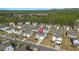 An aerial view of the community featuring a two-story home with a manicured front yard at 4655 Bluffton Ct, Cumming, GA 30028