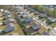 Aerial view showcasing the neighborhood with houses and well-maintained lawns at 4655 Bluffton Ct, Cumming, GA 30028