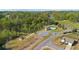 Aerial view showcasing the community's playground, clubhouse, swimming pool, and surrounding greenery at 4655 Bluffton Ct, Cumming, GA 30028