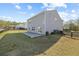 View of the backyard, complete with a well-maintained lawn and a concrete patio at 4655 Bluffton Ct, Cumming, GA 30028